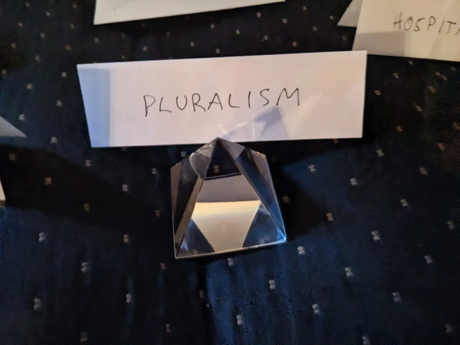 A prism-shaped object on the Ideology Altar with a tent sign labeled Pluralism.