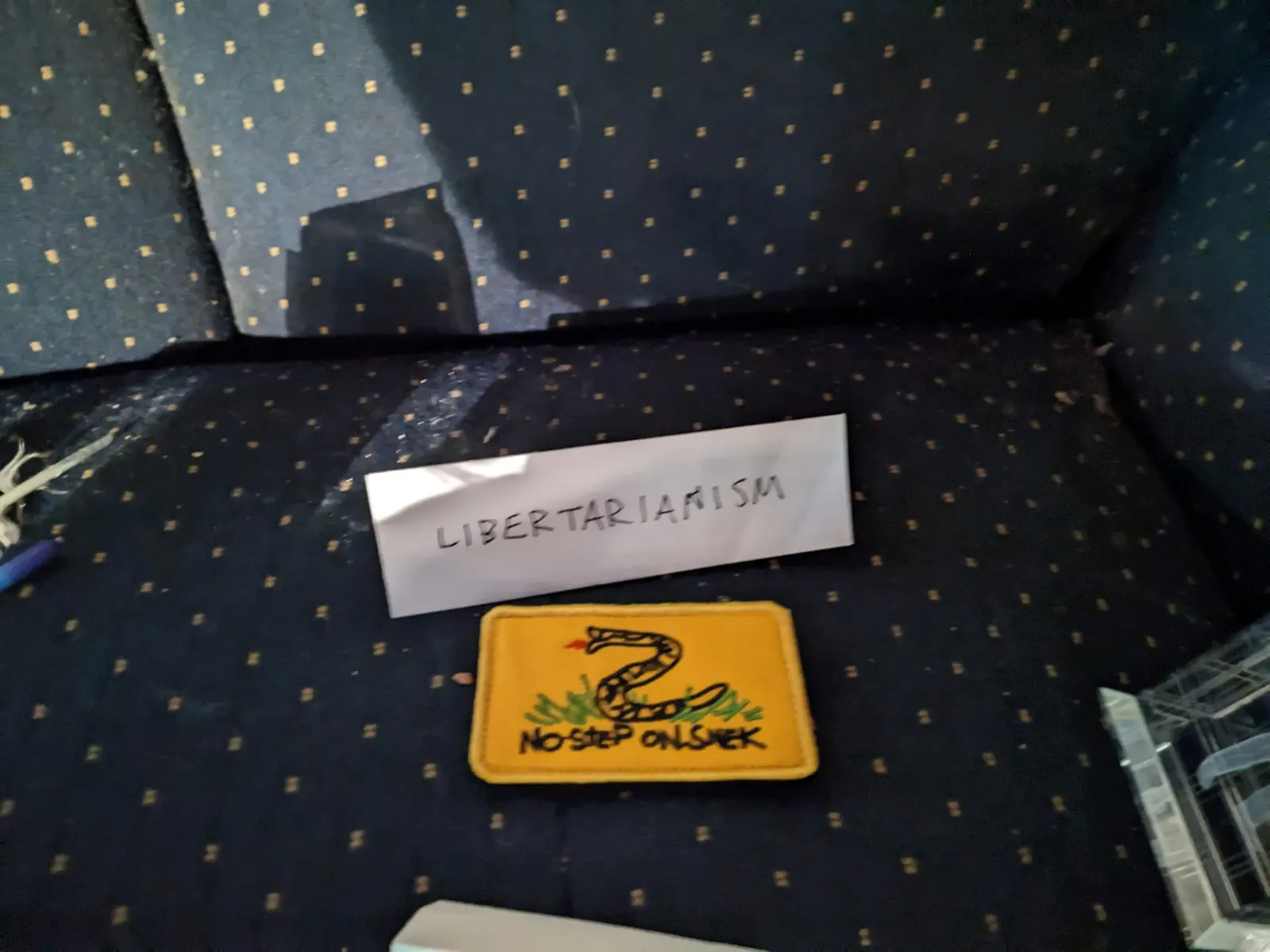 An object on the Ideology Altar with a tent sign labeled Libertarianism.