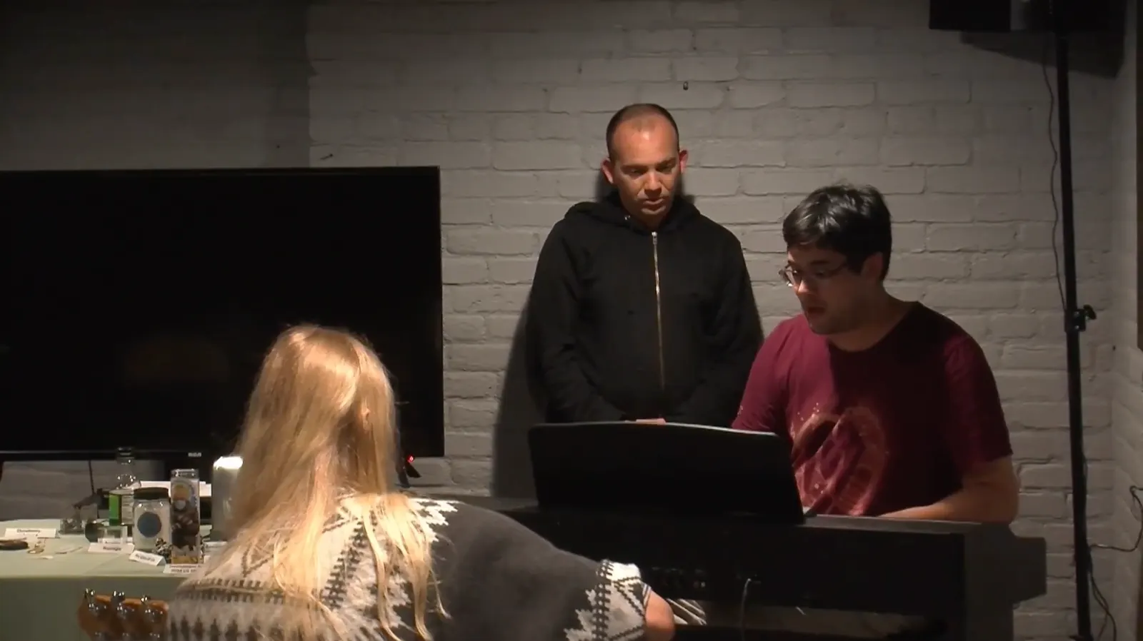 Two participants give a musical presentation at an electric keyboard.